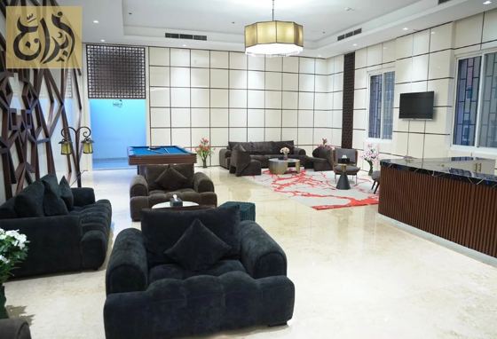 Lobby lounge seating at Abraj Suites Hotel Doha
