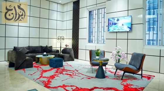 Lobby lounge with television at Abraj Suites Hotel, Al Mansoura, Doha