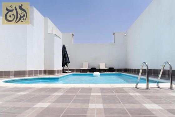 Outdoor swimming pool at Abraj Suites Hotel, Al Mansoura, Doha