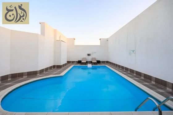 Outdoor swimming pool at Abraj Suites Hotel, Al Mansoura, Doha