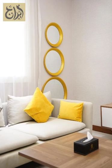 Living room seating corner in a furnished one-bedroom suite at Abraj Suites Hotel Doha