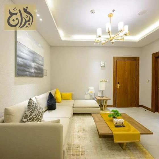 Bright living room in a furnished monthly apartment at Abraj Suites Hotel Doha