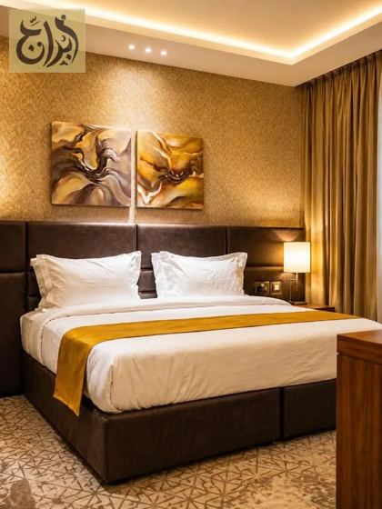 King bed suite bedroom at Abraj Suites Hotel, Al Mansoura, Doha