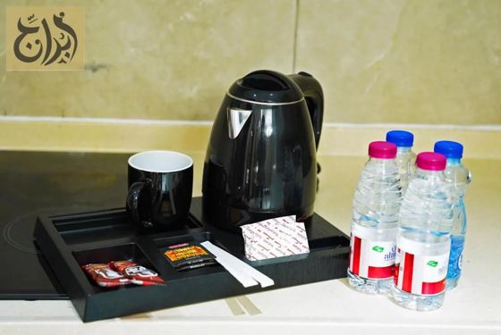 Kettle, tea tray and complimentary bottled water in every suite at Abraj Suites Hotel Doha